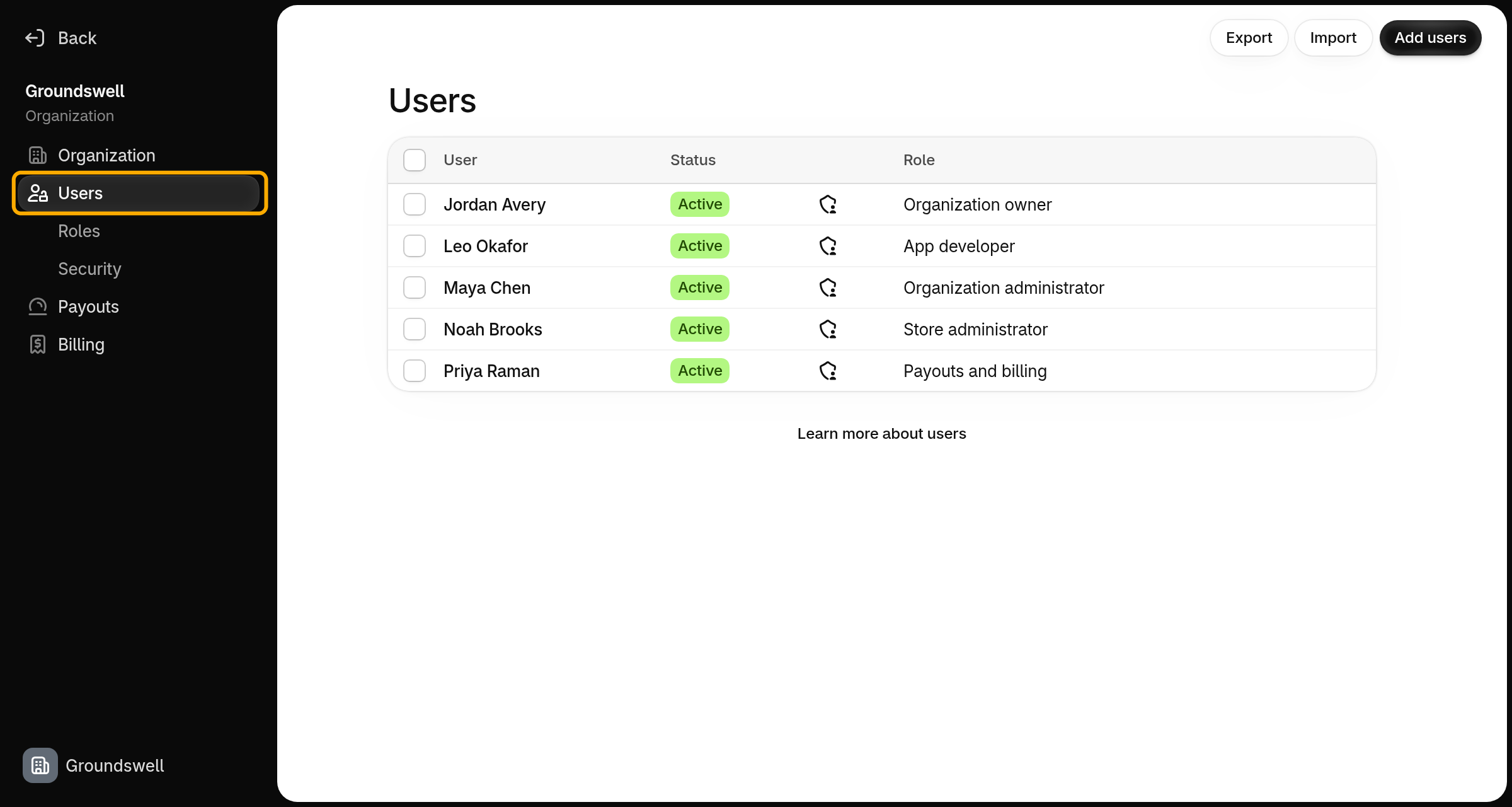 The Users page in Organization settings, with Users highlighted in the navigation, listing team members and their roles.