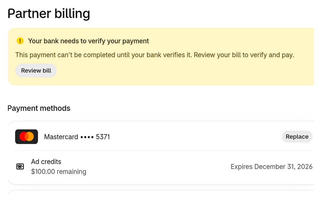 The top of the Partner billing page, showing a payment verification notice, the payment method with Replace, and remaining ad credits.