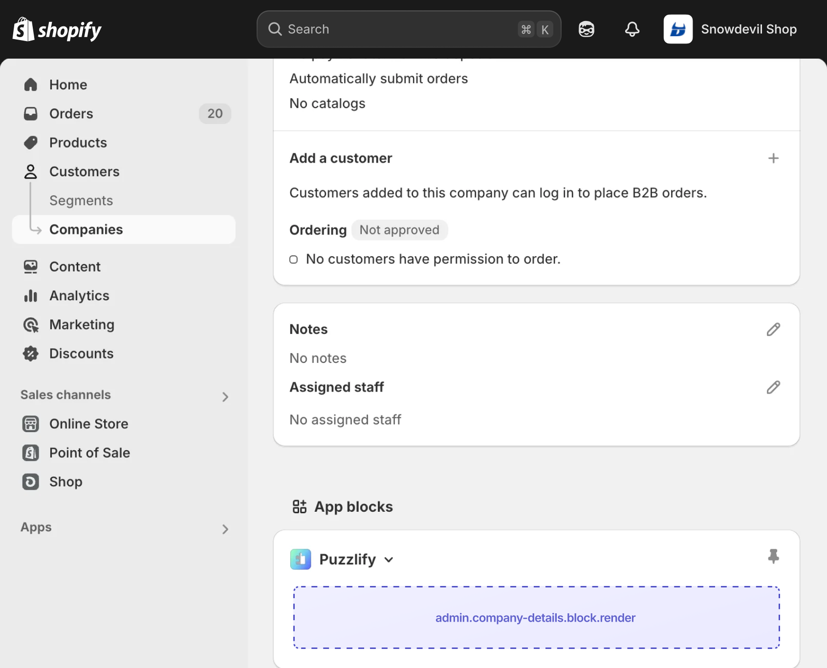 Shopify admin company details page with the extension target slot displayed as an inline app block.