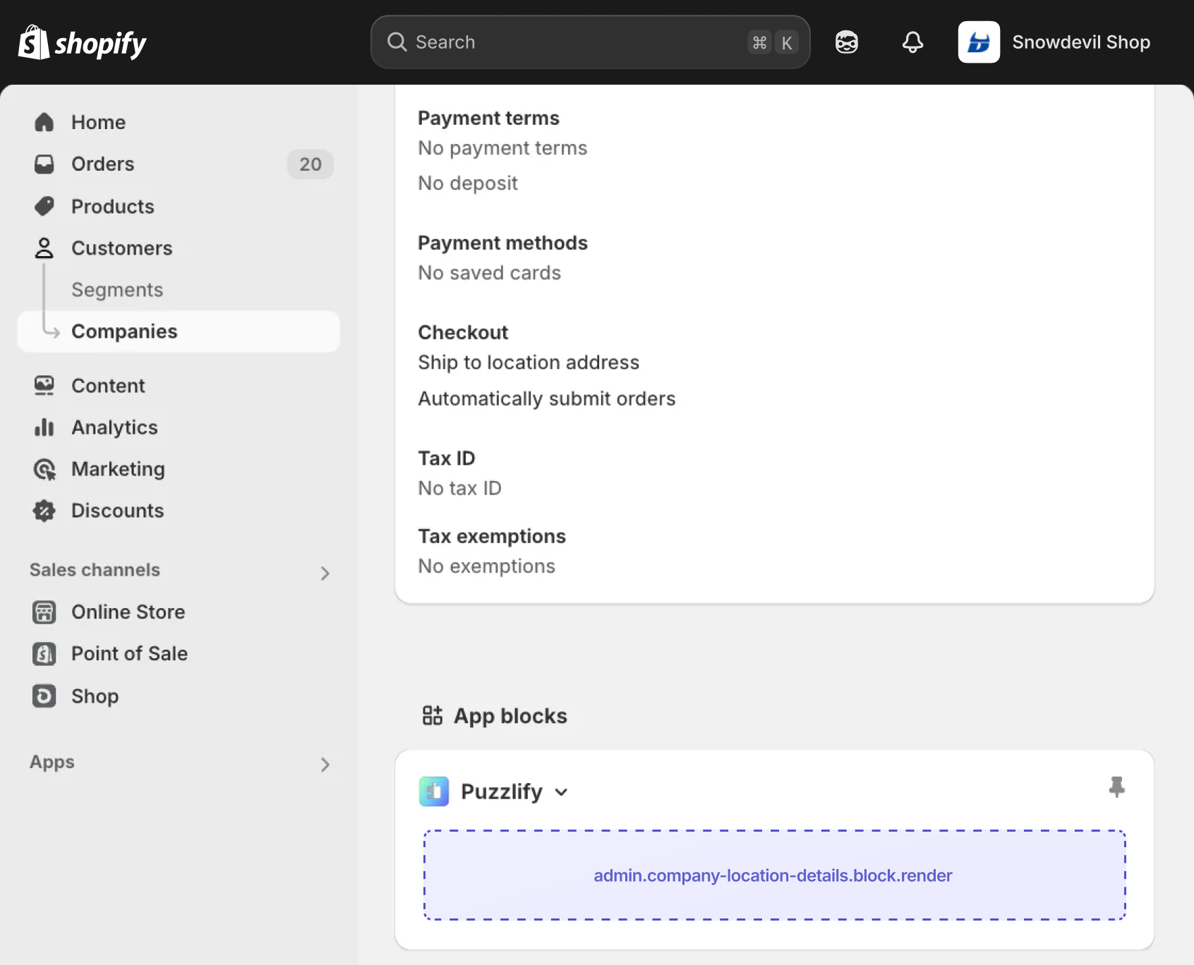 Shopify admin company location details page with the extension target slot displayed as an inline app block.